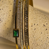 Emerald Accent Gold Bangle with cubic zirconia stone