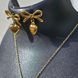 Gold-plated bow-heart necklace and earring set.